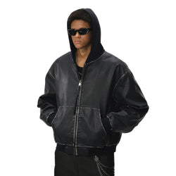 Person wearing a black leather jacket and sunglasses on a white background