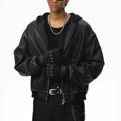 Person wearing a black leather jacket with a white background