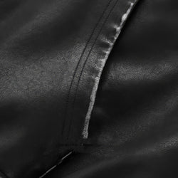 Close-up of black leather texture with a zipper