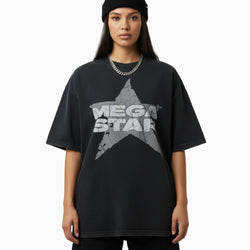 Person wearing a black oversized t-shirt with &