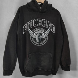 Black hoodie with white graphic design on a gray background