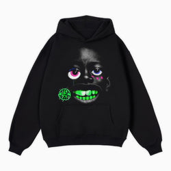 Black hoodie with a graphic design of a face with glowing green teeth and text on a white background