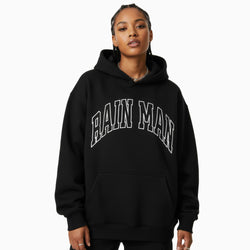 Person wearing a black hoodie with &