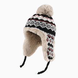 Knitted hat with fur trim on a white background