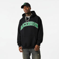 Person wearing a black hoodie with &