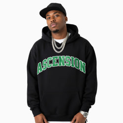 Man wearing a black hoodie with &