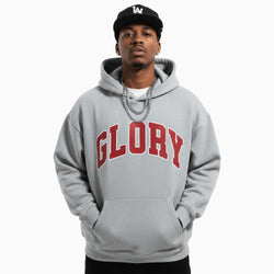 Person wearing a gray hoodie with &