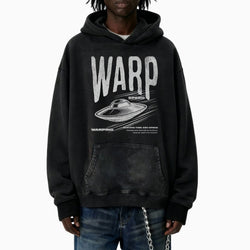 Person wearing a black hoodie with &