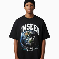 Person wearing a black t-shirt with &