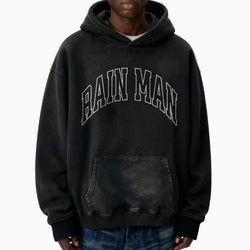 Person wearing a black hoodie with &